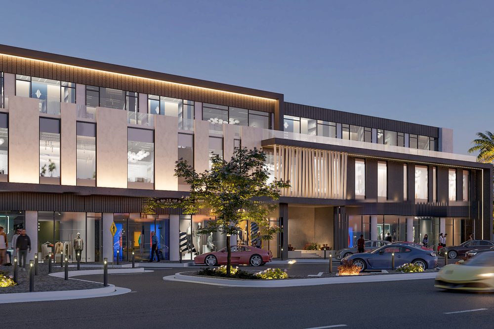 A dusk render of The Corner 2 in Al Khuwair: lit shopfronts at street level under two office floors.