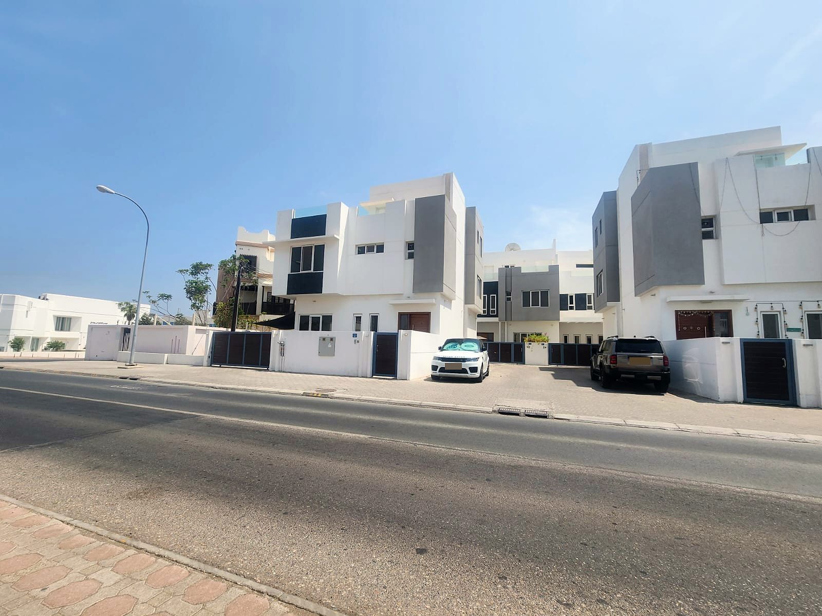 Hilal Al Barwani villas and shared courtyard, Madinat Al Sultan Qaboos · 2