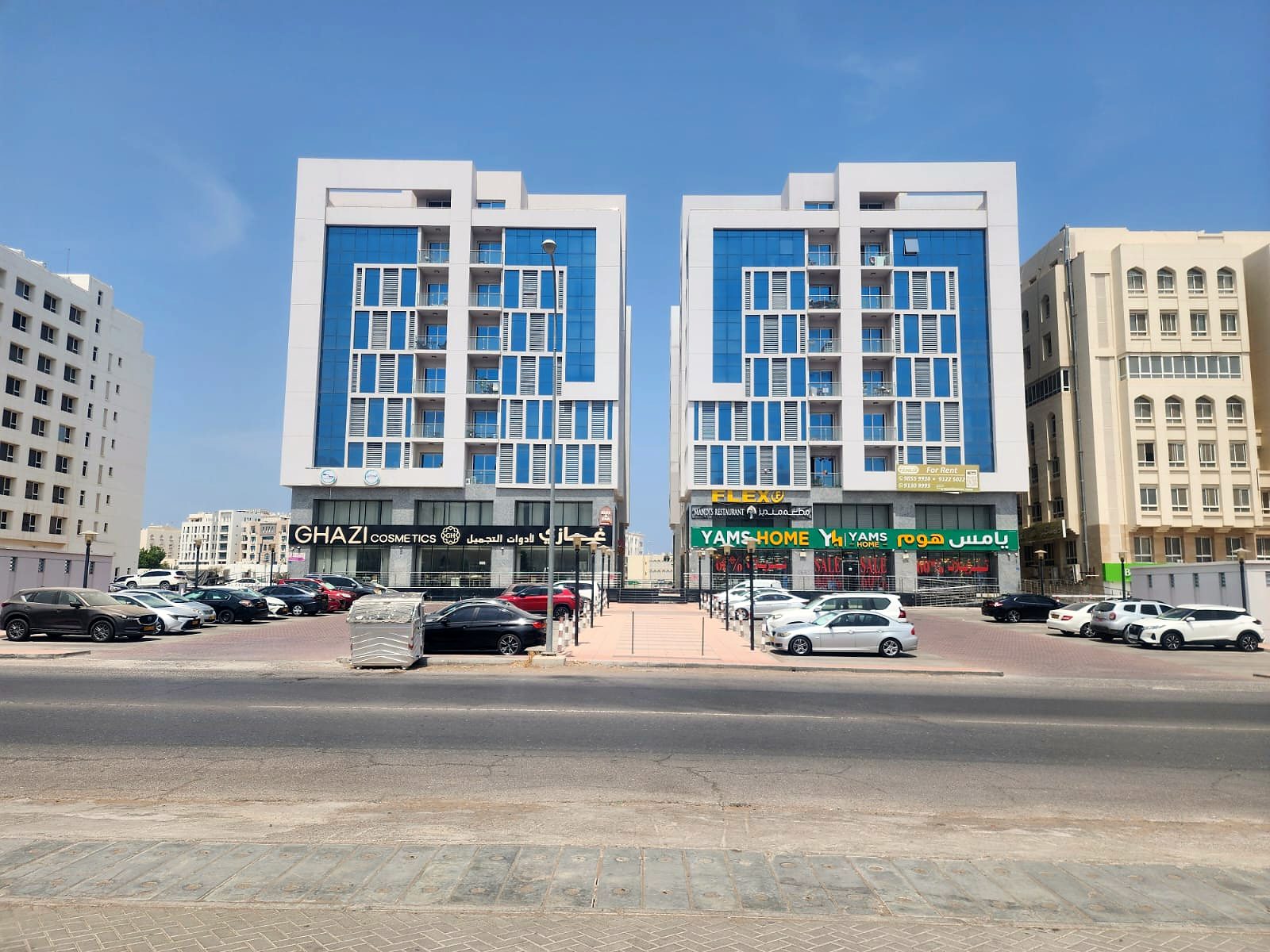 Twin Tower, Al Khuwair: the two towers and their street-level shops · 2